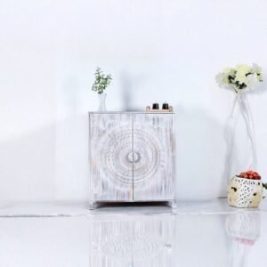 White distressed wooden bar cabinet with hand-carved mandala doors – front view.