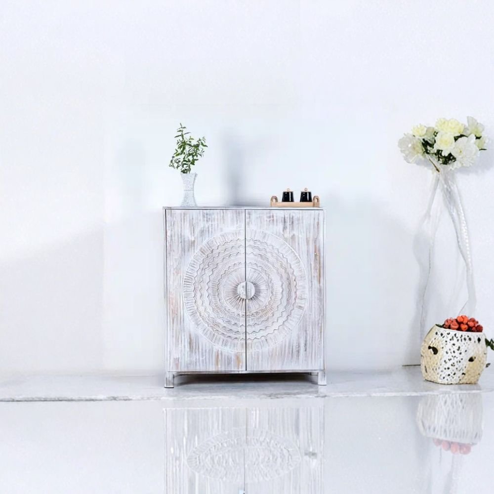 White distressed wooden bar cabinet with hand-carved mandala doors – front view.