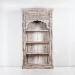 Handcrafted whitewashed jharokha carved wooden bookrack and display cabinet with traditional Indian arch design