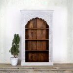 Handcrafted whitewashed jharokha carved wooden bookrack and display cabinet with traditional Indian arch design