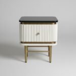 Handcrafted mango wood bedside table with fluted design, brass legs and brass inlay, modern luxury bedroom nightstand