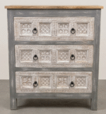Hand carved wooden chest of drawers with distressed grey finish and decorative carved drawer panels