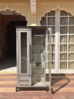 compact display cabinet with glass doors and dark top for bedroom or living space