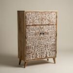Hand-carved wooden cabinet with tribal art motifs