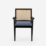Solid wood dining chair with cane backrest and upholstered seat in black finish