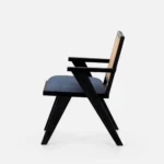 Solid wood dining chair with cane backrest and upholstered seat in black finish