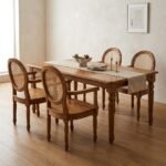 Premium teak wood dining chair with round cane back and natural finish